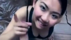 Cute asian girl sucks white cock
