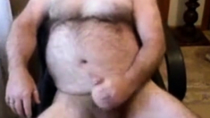 Hairy daddy bear stoking his cock